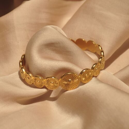 Gold steel Sol bangle